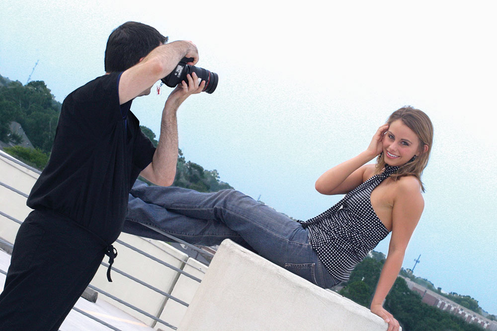 Photographer taking picture of woman
