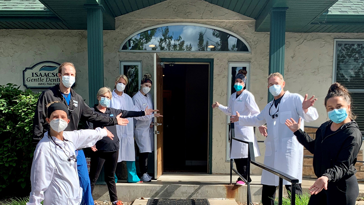 Dr. Dan Isaacson and his team outside their dental practice