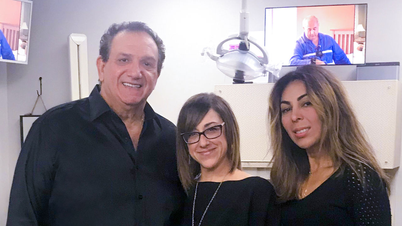 Callie Ferreira (middle) and Elaine Steckel (right) have worked with Dr. John Viviano for over 25 years.