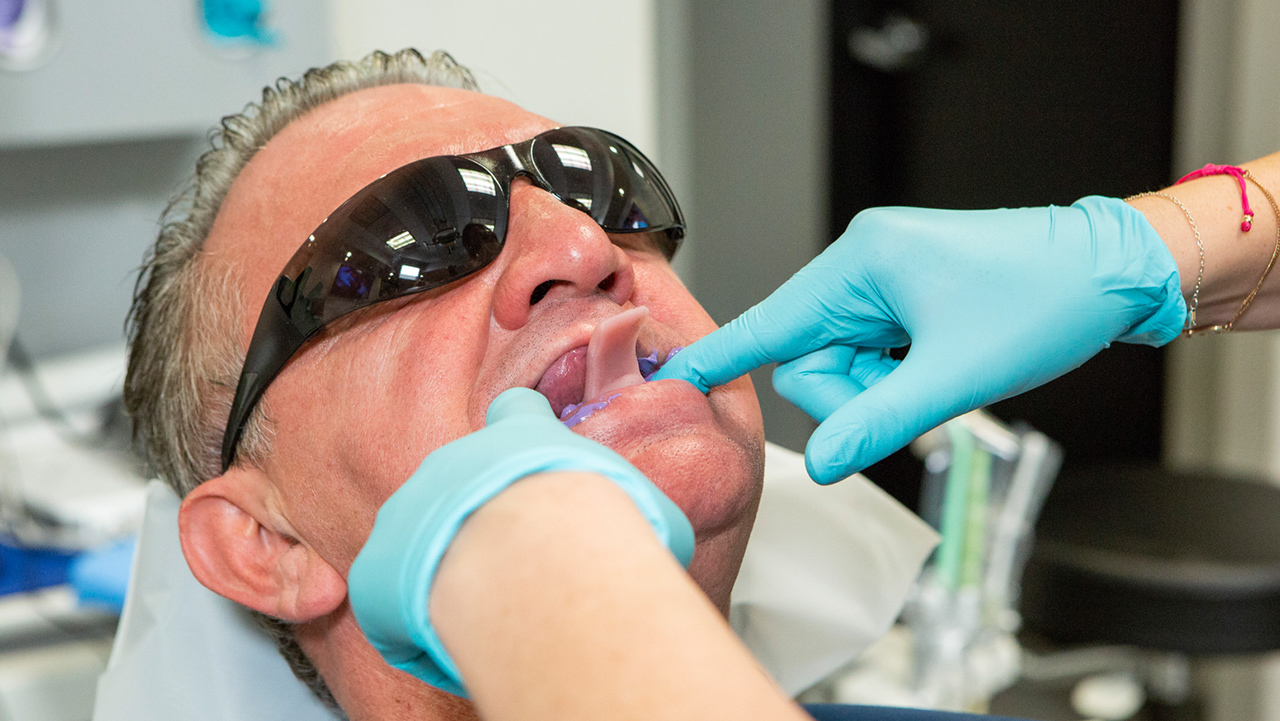 Doctor taking a patient impression