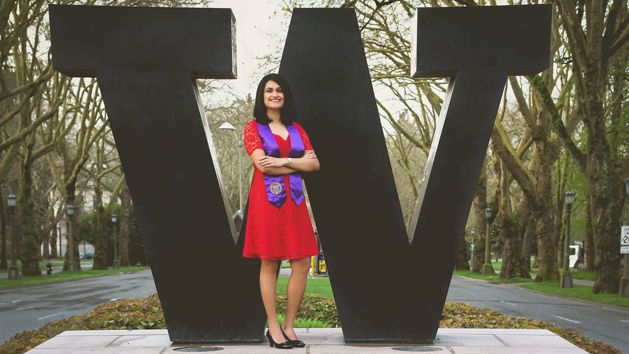 Dr. Deshpande, a University of Washington graduate, stands wearing her stole