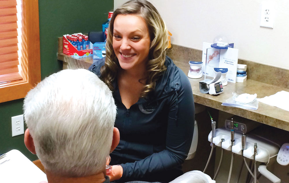 Dr. Erin Elliott’s in-house dental sleep medicine coordinator, Bri screening a patient