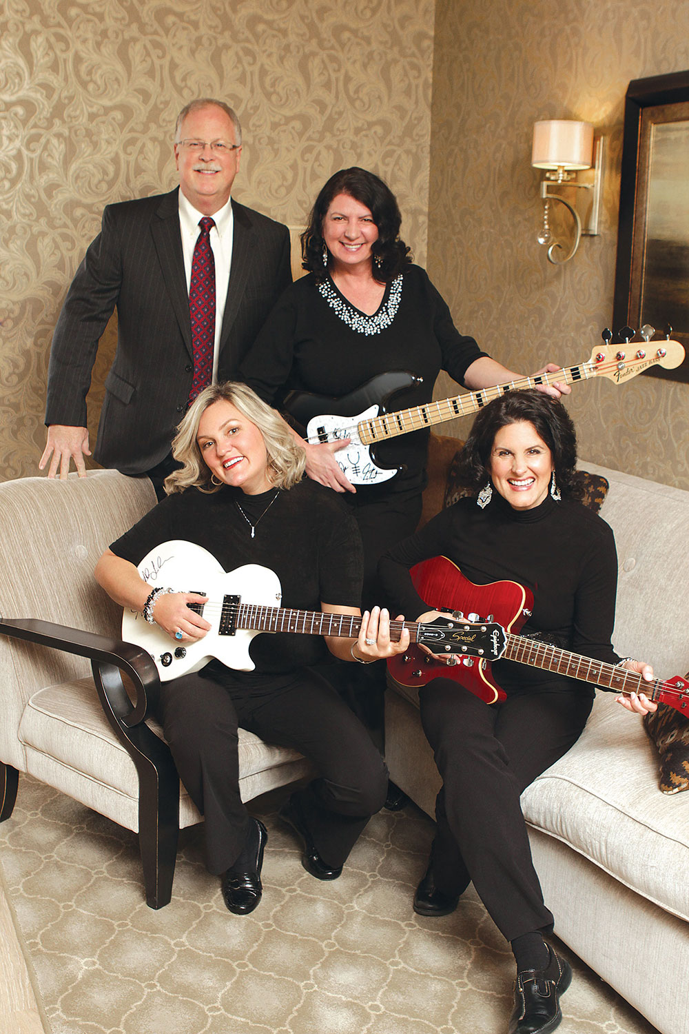 Rob Lowe and his three dental assistants holding electric guitars