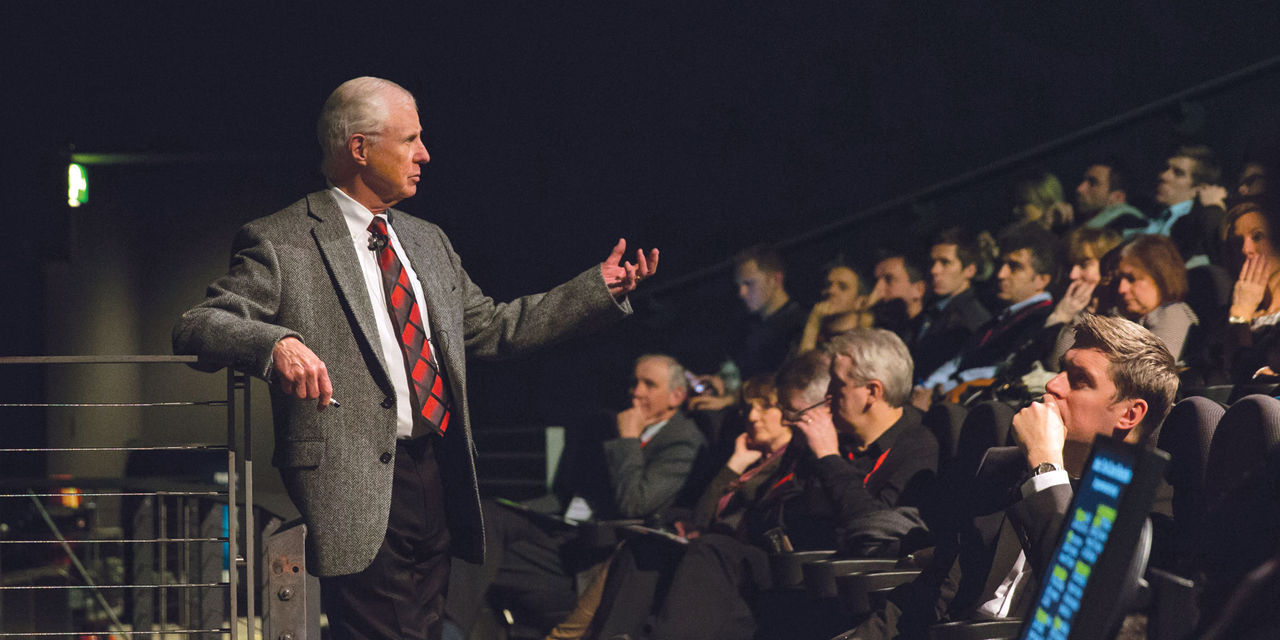 Dr. Christensen speaks to an audience during a lecture
