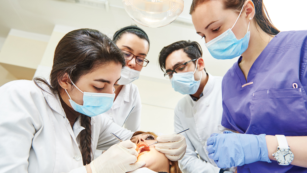 Dental students observing a procedure