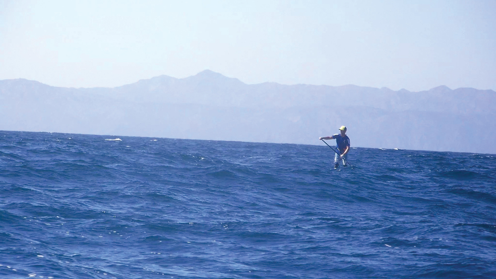 Will Schmidt paddle boarding in the ocean