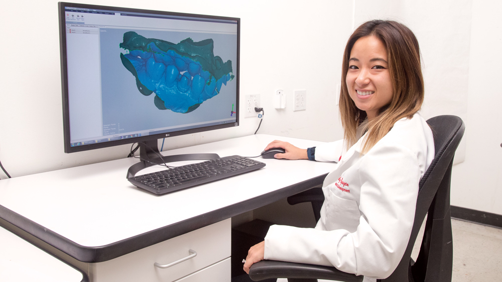 Emily Nguyen showing her 3D model in the computer