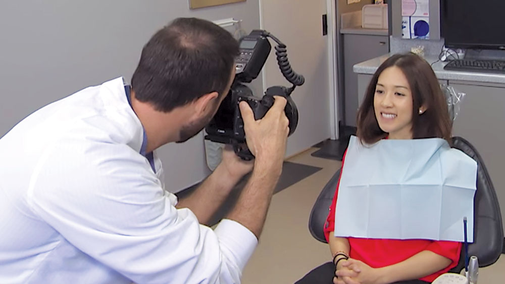 Dentist takes photo of patient's teeth