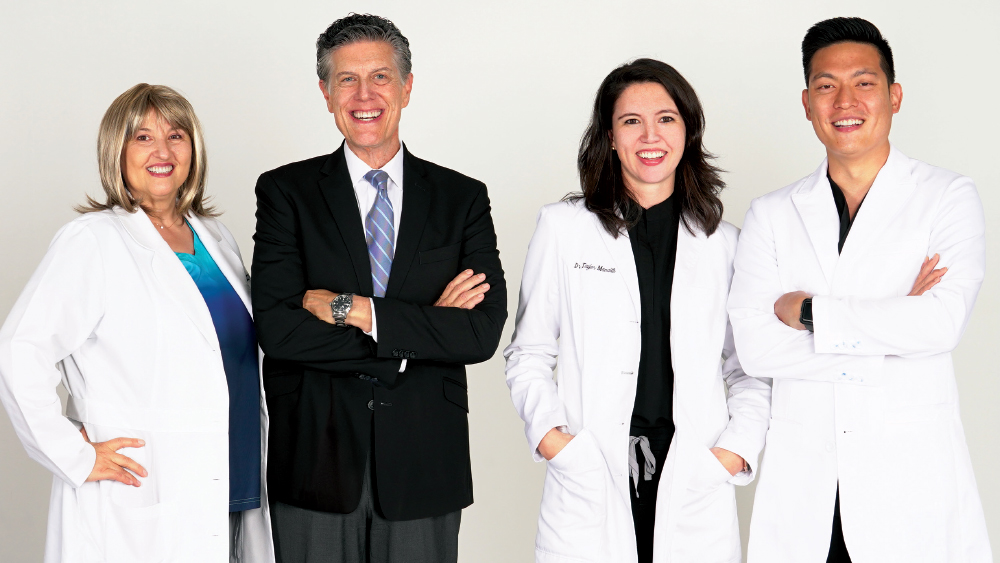 Dr. Taylor Manalili (second from right), with Glidewell Dental Director of Clinical Research Dr. Anamaria Muresan (left), Vice President of Clinical Affairs Dr. Neil Park (second from left) and Director of Clinical Technologies Dr. Justin Chi (right).