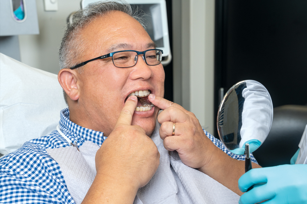 Patient trying on his first silent nite appliance