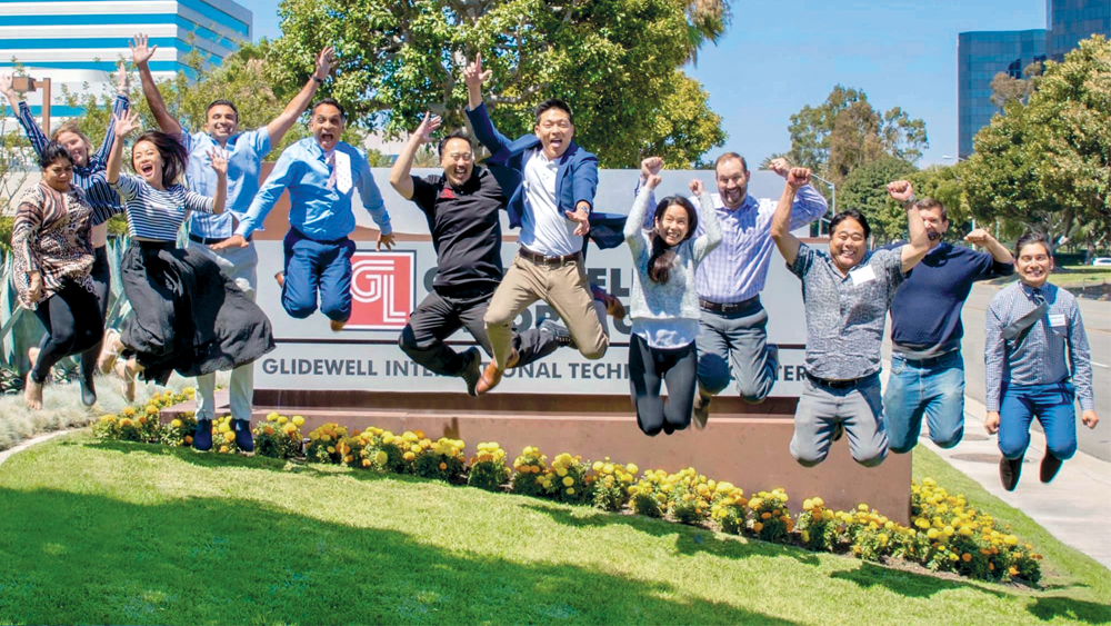 Glidewell employees jumping in the air in unison