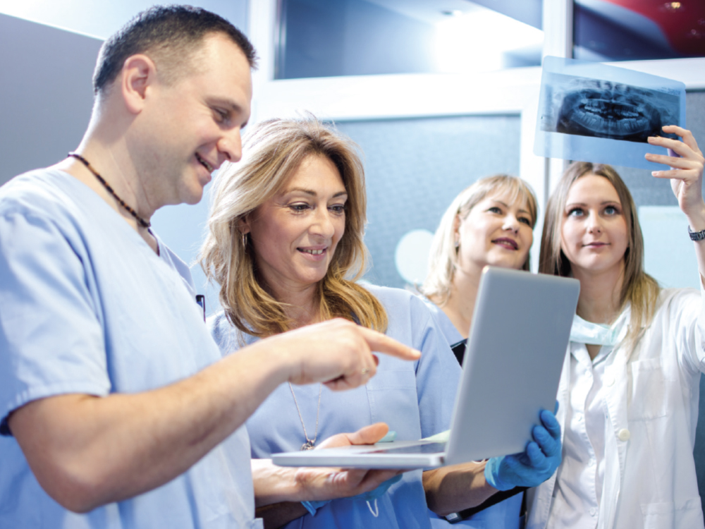 Dental staff working together on a diagnosis