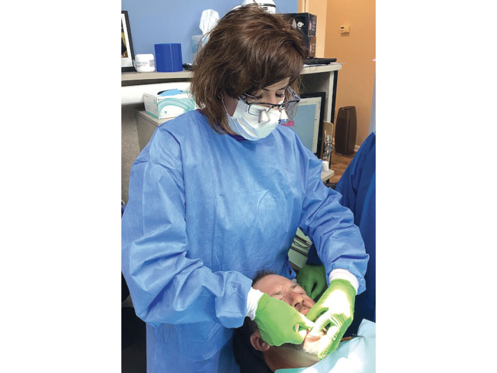 Dr. Tilley performing an implant placement for a full-arch restoration