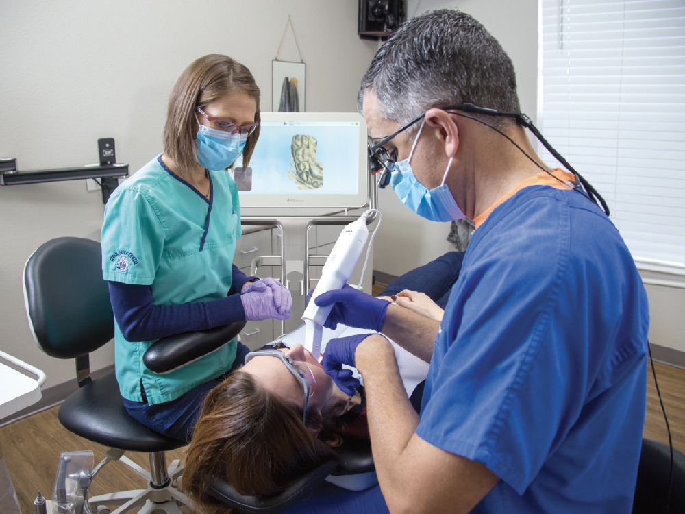 Dentists work on patient