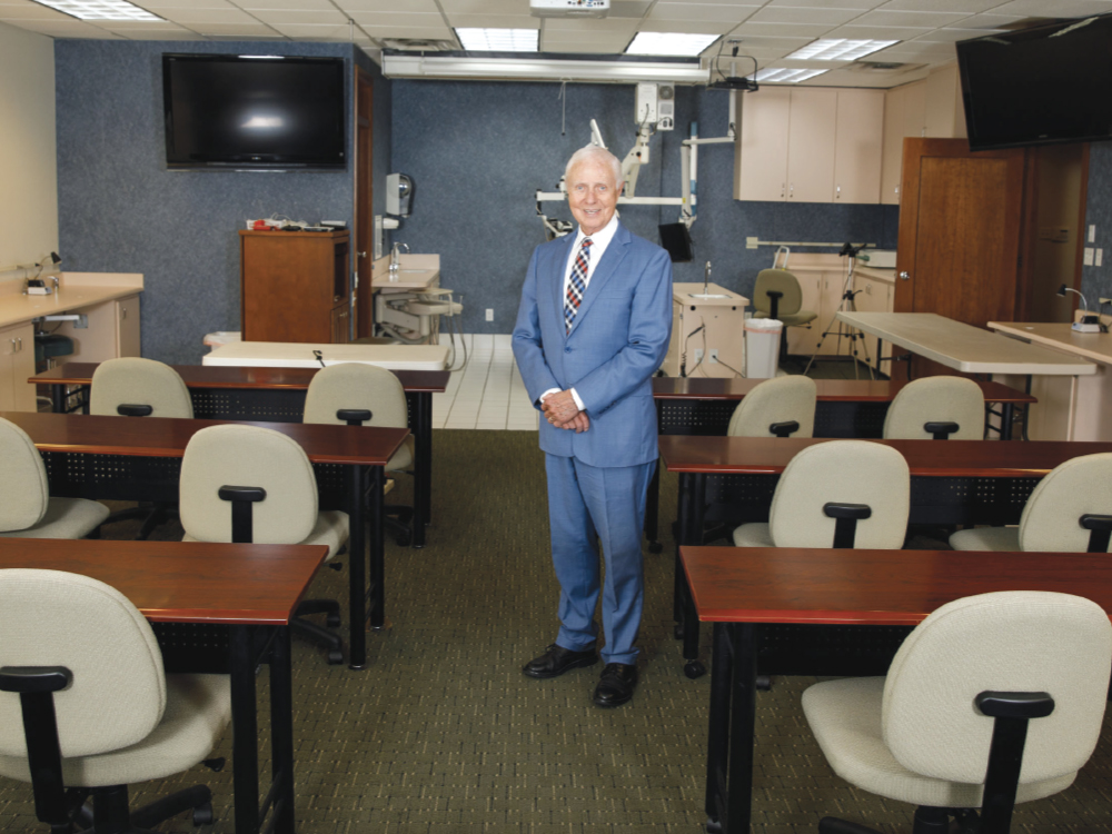 Dr. Christensen in the Practical Clinical Courses seminar room where live patients are treated, hands-on courses are conducted and educational videos are produced.