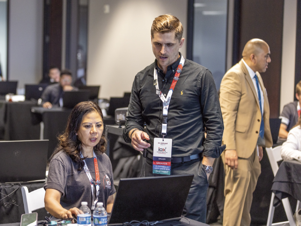 Dr. David Zant guides an IOX attendee through a hands-on exercise covering 3D printing.