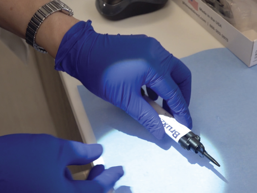 BruxZir Dual Cure Resin held in hand
