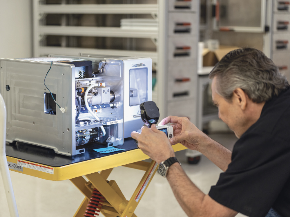 A glidewell.io mill being inspected