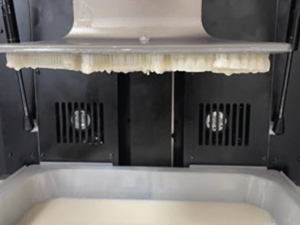 Industrial 3D printer extruding material