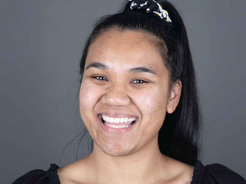 Woman with black hair and patterned scrunchie