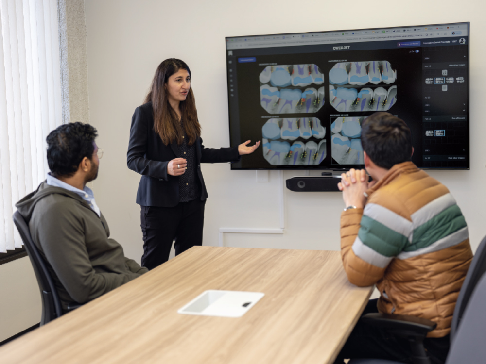 Dr. Inam Reviewing the X-Ray Graphic Interface Seen Through Overjet