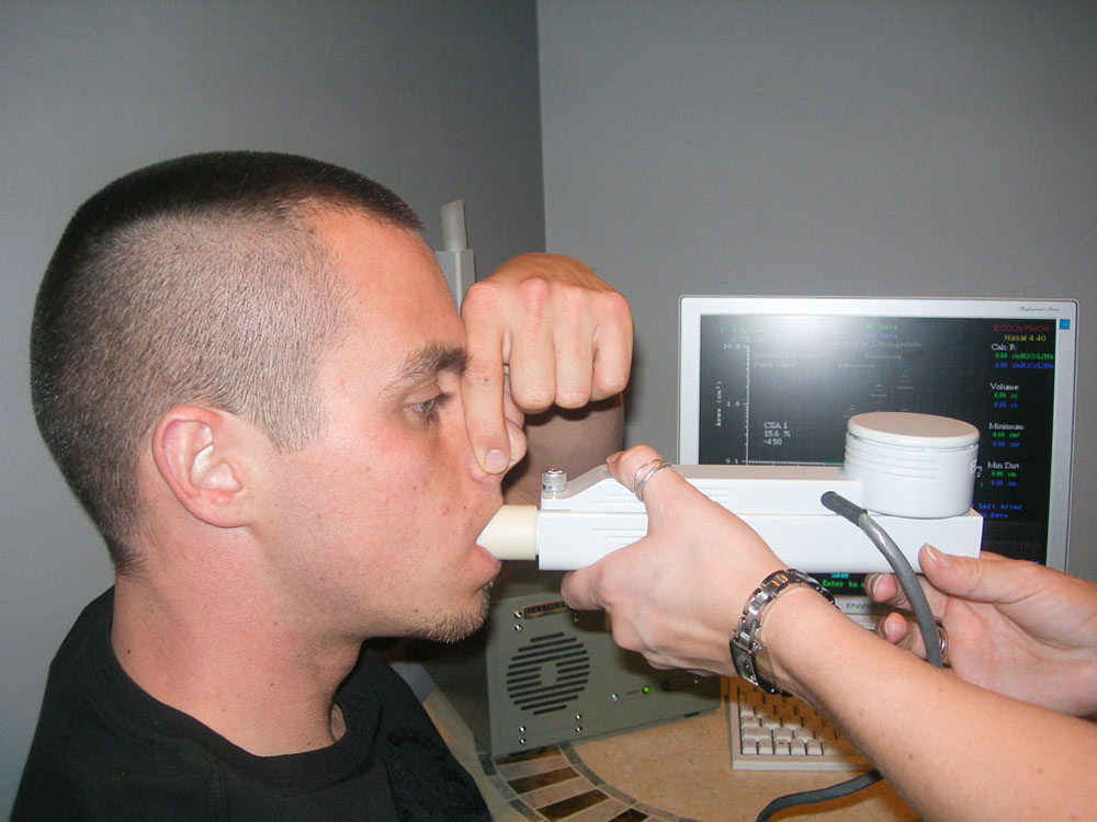 Patient plugging his nose to isolate airflow