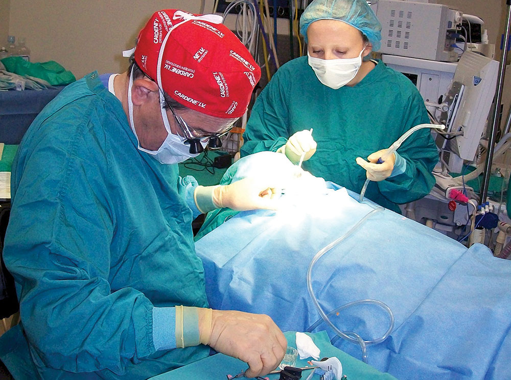 Dr. John Harden working on a patient 