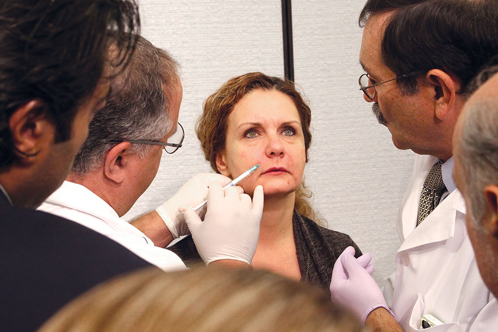 Dentist injects filler as other doctors watch